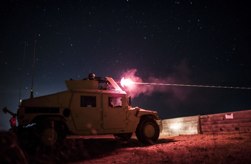 A U.S. Army Reserve military police gunner from the 341st MP Company, of Mountain View, California, shoots at target with an M240B machine gun during a mounted crew-served weapon night fire qualification table at Fort Hunter-Liggett, California, May 3. The 341st MP Co. is one of the first units in the Army Reserve conducting a complete 6-table crew-serve weapon qualification, which includes firing the M2, M249 and M240B machine guns both during the day and night. (U.S. Army photo by Master Sgt. Michel Sauret)