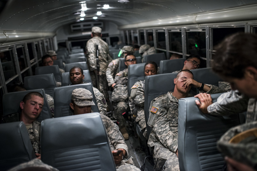 U.S. Army Reserve Combat Engineer Soldiers from the 374th Engineer Company (Sapper), headquartered in Concord, Calif., take a break on a bus after completing a night land navigation course through the hills and mountains of Camp San Luis Obispo Military Installation, Calif., July 15, during a two-week field exercise known as a Sapper Leader Course Prerequisite Training. The land navigation course began after dark and most Soldiers didn't finish until after midnight after trecking for miles through the steep California hills. The unit is grading its Soldiers on each event to determine which ones will earn a spot on a "merit list" to attend the Sapper Leader Course at Fort Leonard Wood, Mo.