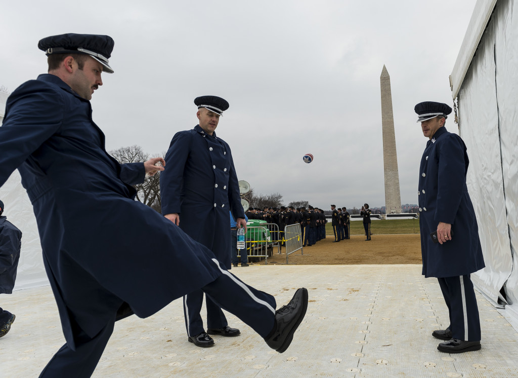U.S. Air Force band members play hacky sack before taking part in the 58th Presidential Inauguration Parade in Washington, D.C., on Jan. 20. The parade route stretched approximately 1.5 miles along Pennsylvania Avenue from the U.S. Capitol to the White House. (U.S. Army Reserve photo by Master Sgt. Michel Sauret)