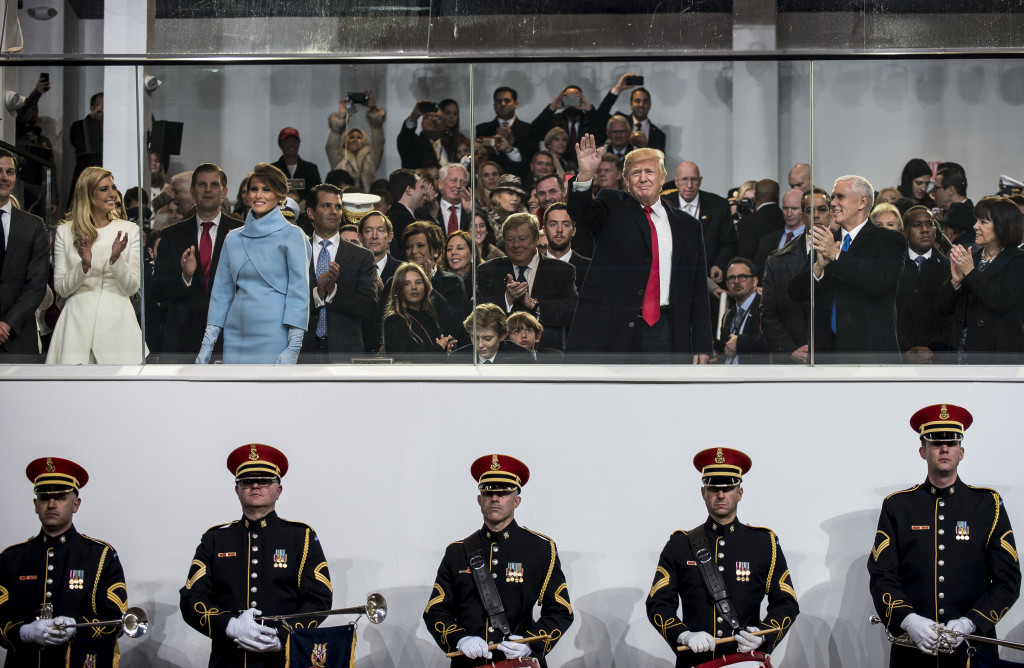U.S. President Donald Trump greets the crowd from the presidential review stand during the 58th Presidential Inauguration Parade in Washington, D.C., on Jan. 20. The parade route stretched approximately 1.5 miles along Pennsylvania Avenue from the U.S. Capitol to the White House. (U.S. Army Reserve photo by Master Sgt. Michel Sauret)