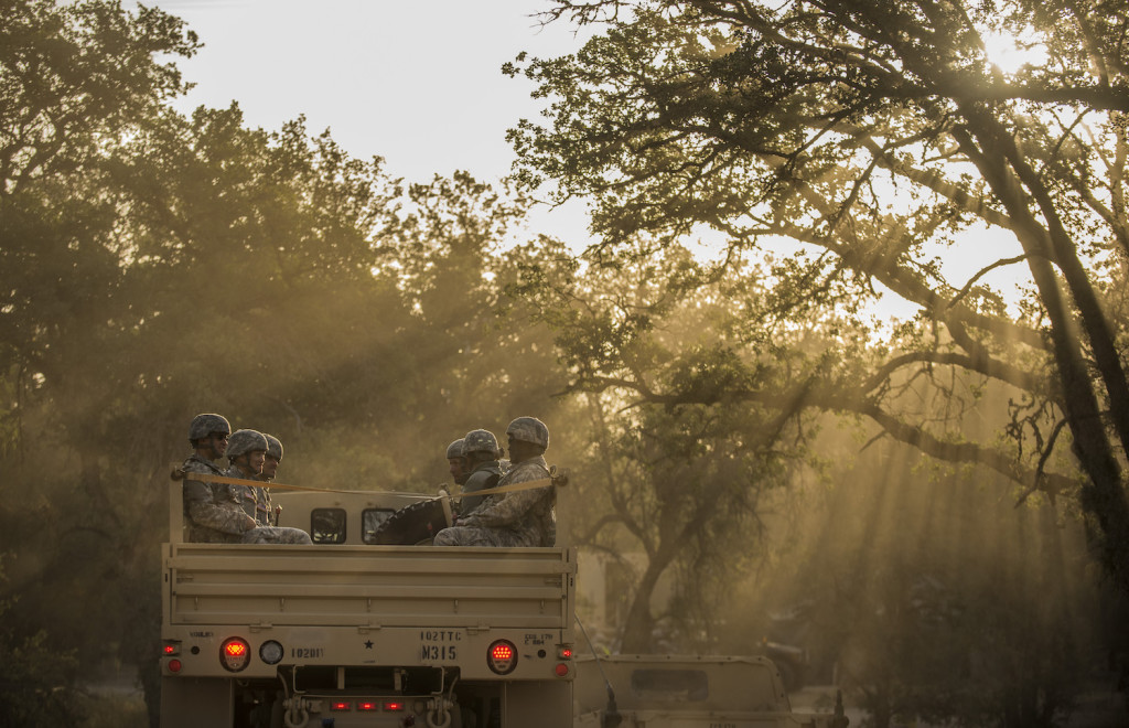 A group of U.S. Army Reserve Soldiers ride on the back of a troop-carrier truck after eating breakfast to go training on Fort Hunter-Liggett, California, May 3. Approximately 80 units from across the U.S. Army Reserve, Army National Guard and active Army are participating in the 84th Training Command's second Warrior Exercise this year, WAREX 91-16-02, hosted by the 91st Training Division at Fort Hunter-Liggett, California. (U.S. Army photo by Master Sgt. Michel Sauret)