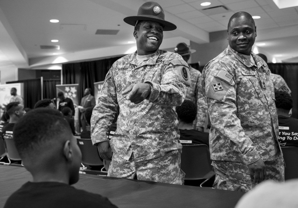Staff Sgt. Dennis Howard, an Army Reserve drill instructor with the 2-330th Infantry Battalion, One Station Unit Training, and Sgt. 1st Class Michael S. Young Jr., an assistant inspector general for the 416th Theater Engineer Command, joke with a Chicago teenager during the Steve Harvey Mentoring Weekend hosted at Chicago State University the weekend of Jan. 23-25. (U.S. Army photo by Sgt. 1st Class Michel Sauret)